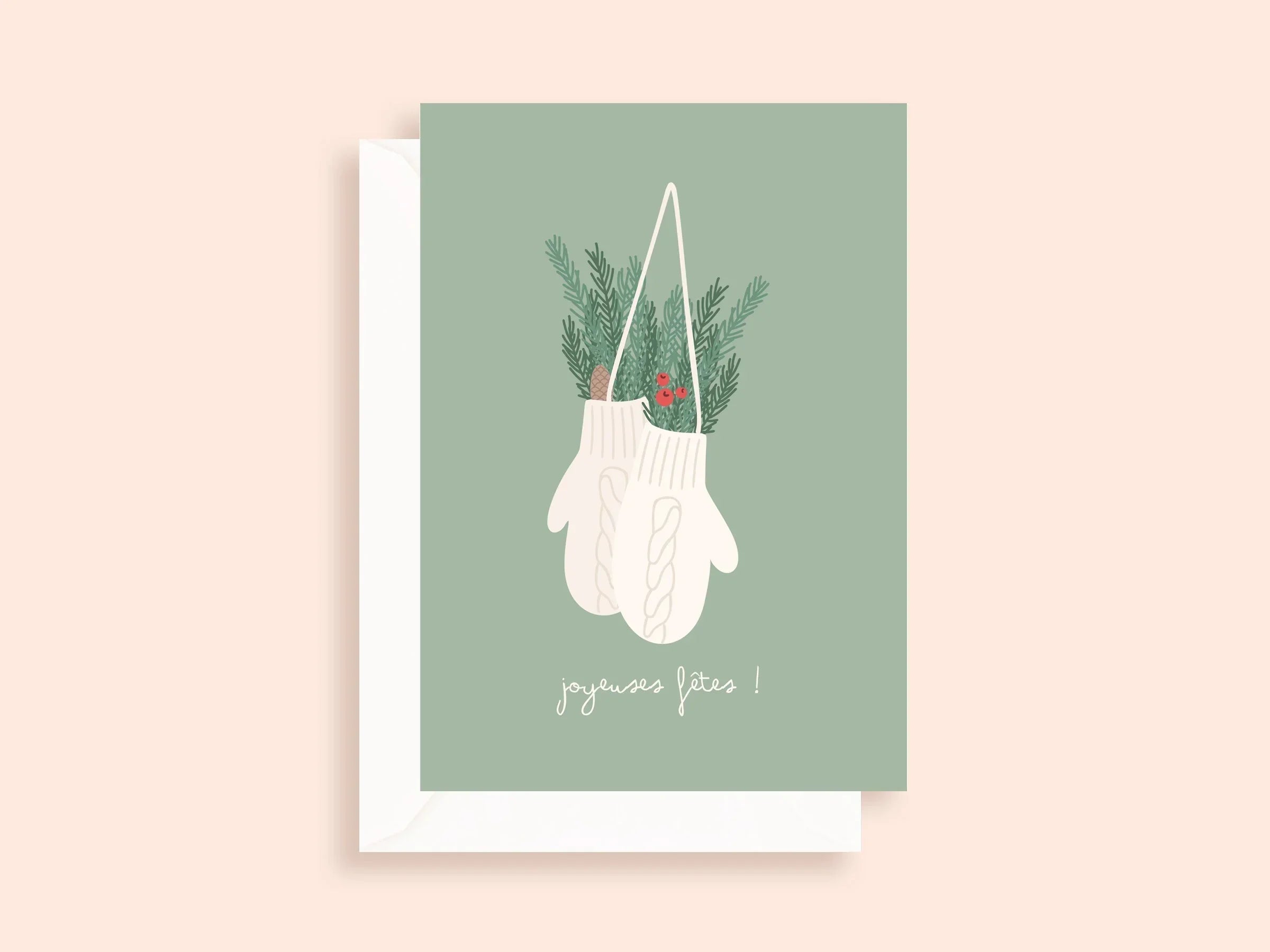 Carte de vœux minimaliste avec moufles blanches suspendues et décorations vertes, joyeuses fêtes