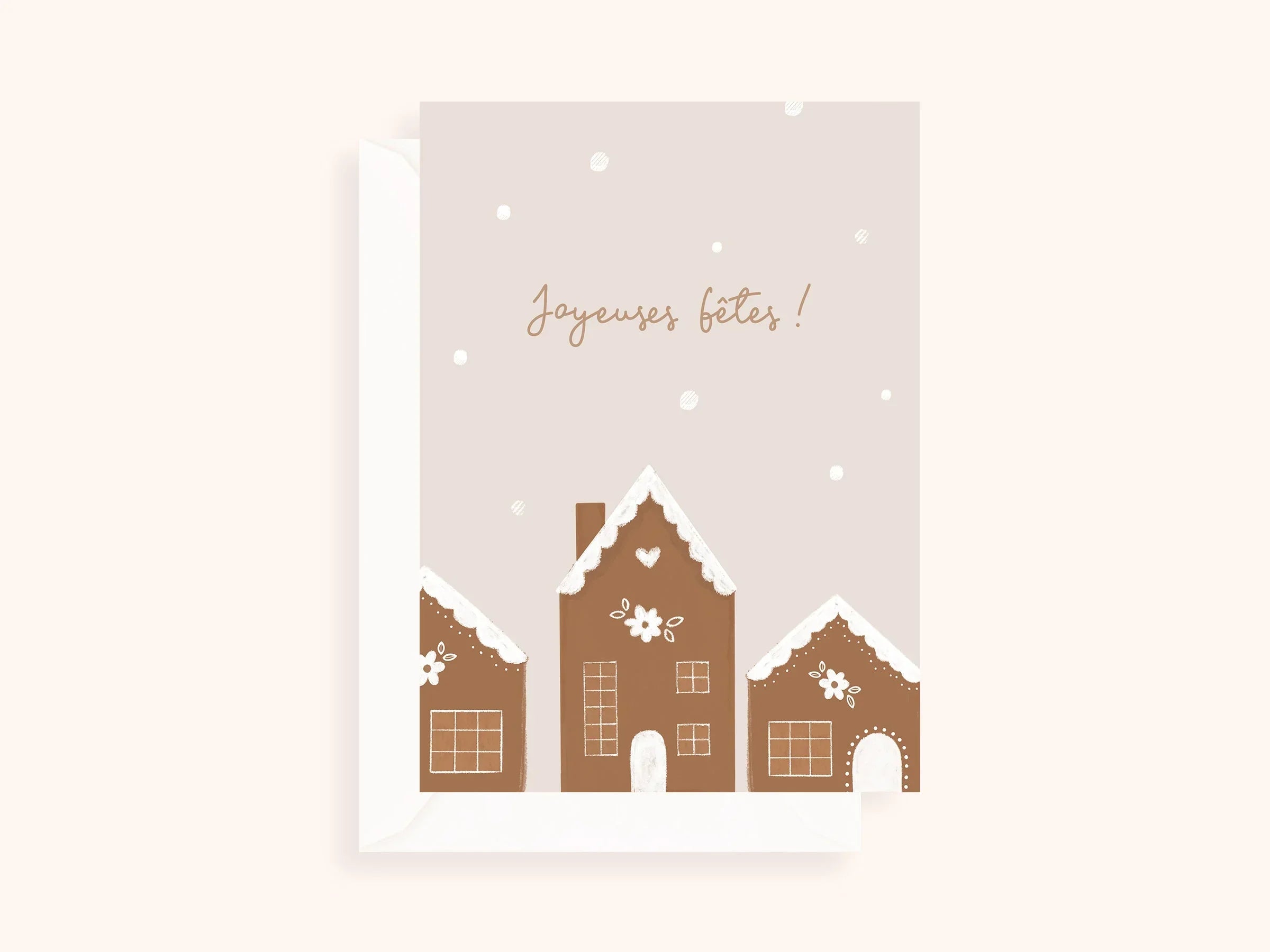 Carte de vœux festive avec maisons en pain d'épices décorées et texte Joyeuses fêtes