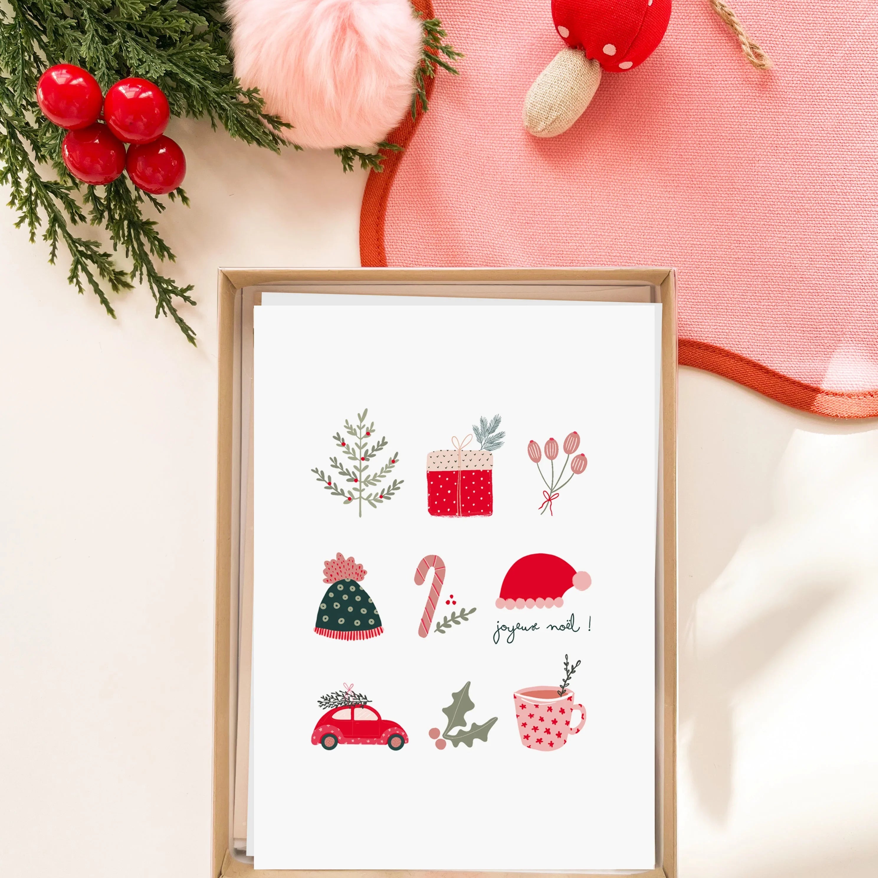 Carte de vœux de Noël avec illustrations festives et message joyeux Noël dans une boîte en carton