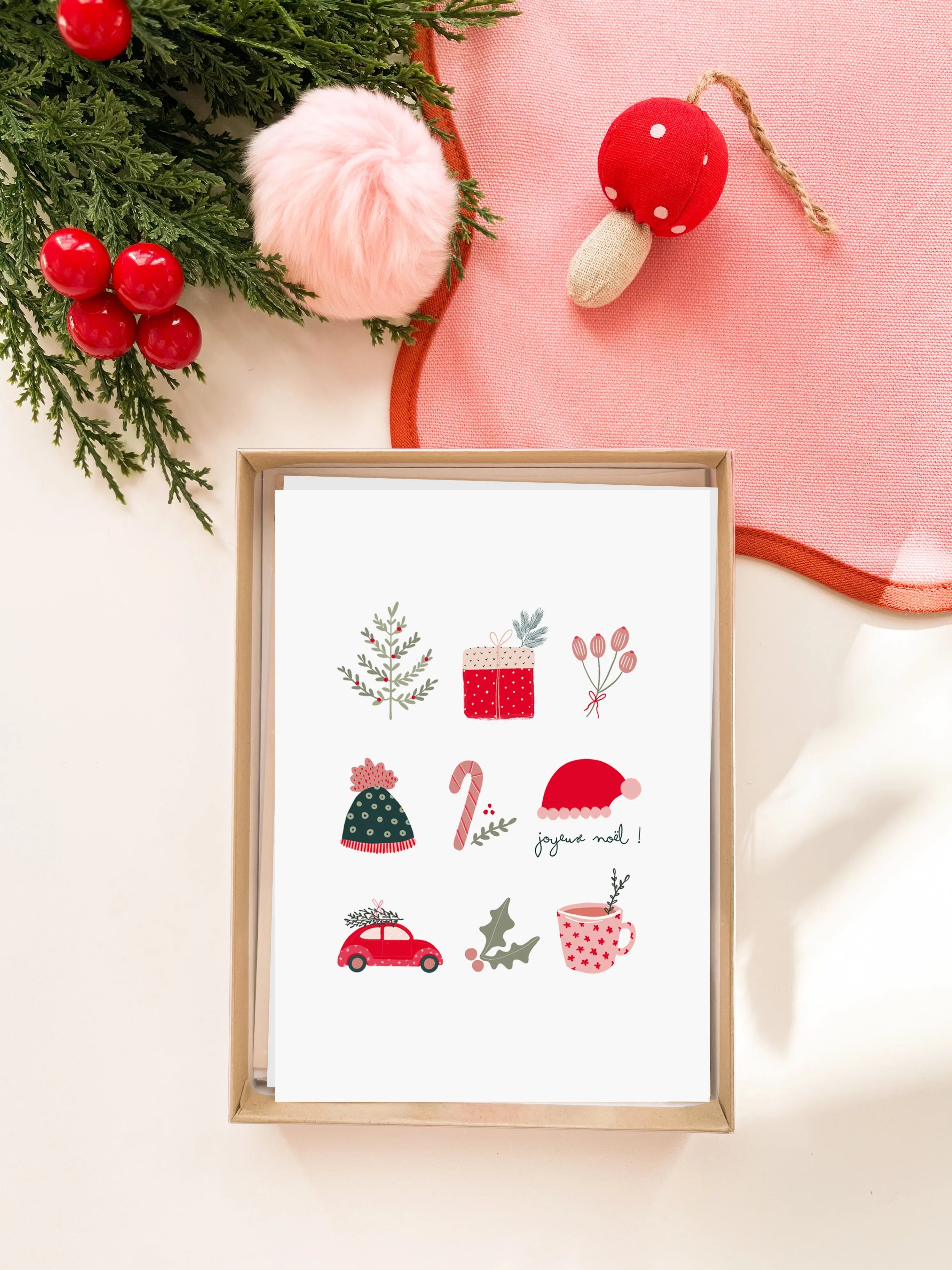 Carte de vœux de Noël avec illustrations festives et message joyeux Noël dans une boîte en carton